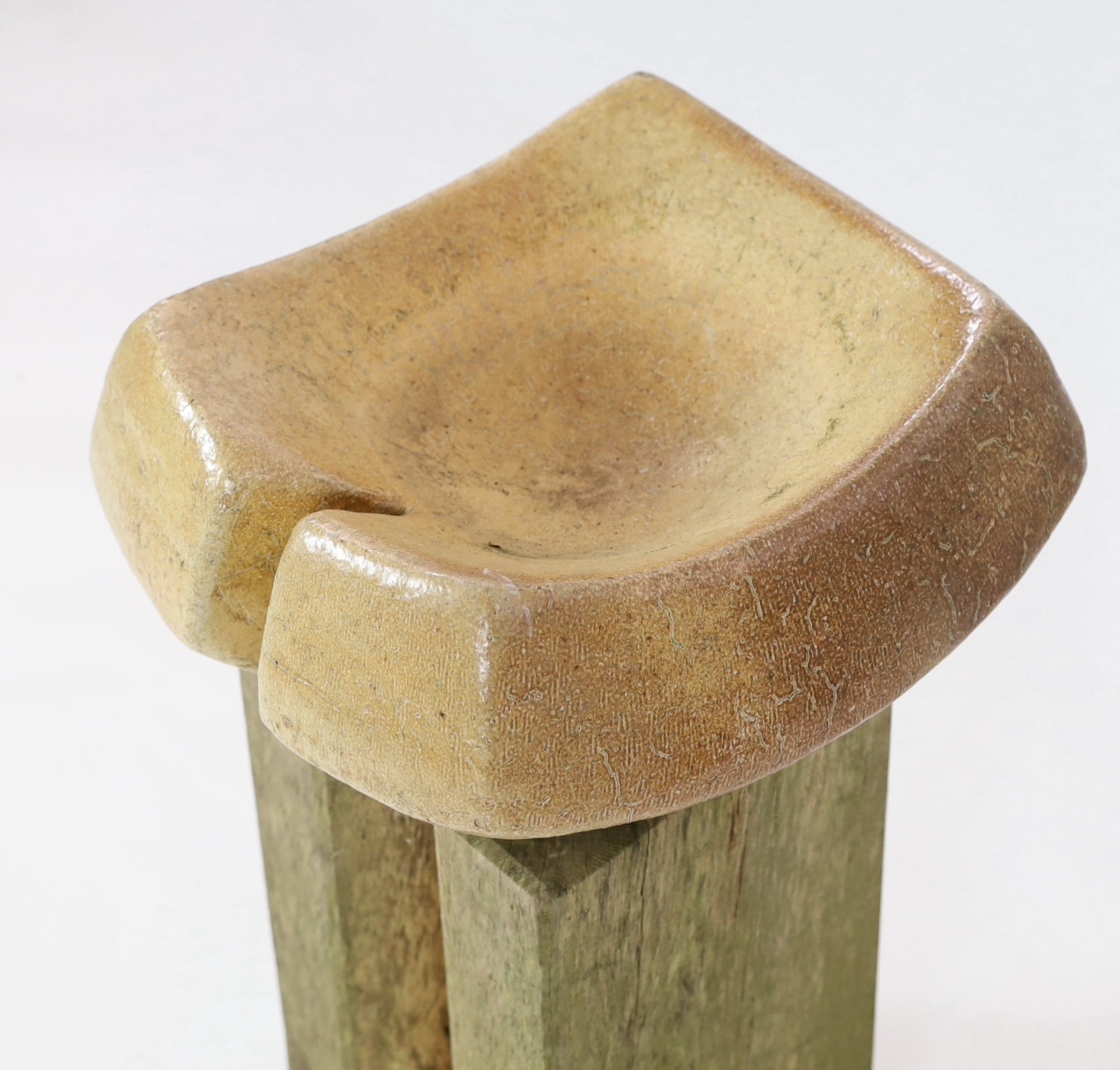 Sarah Walton (b.1945), a large salt glaze stoneware bird bath on a wood pedestal, total dimensions 42cm wide 82cm high